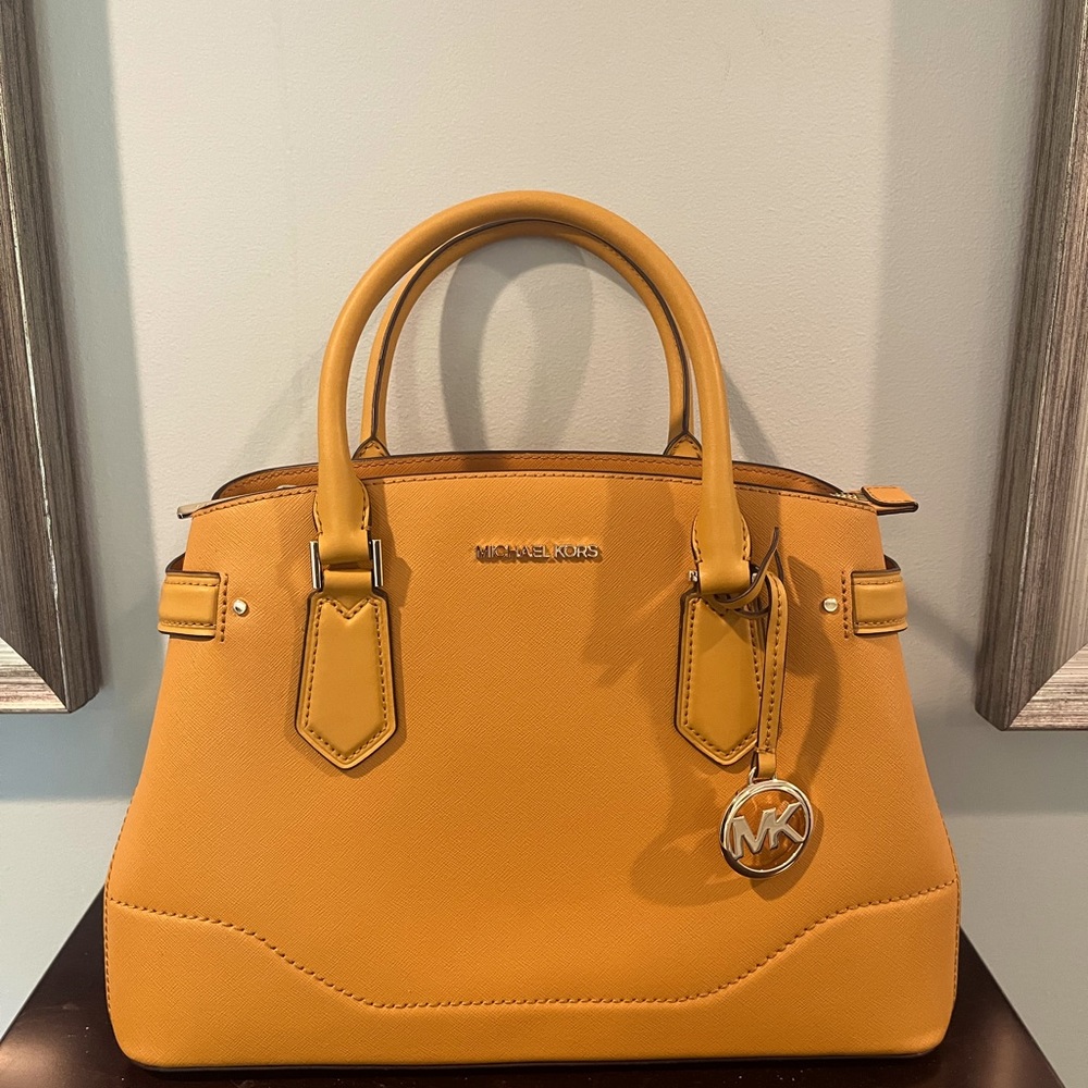 Michael Kors Handbag with detachable shoulder strap. Color is mustard yellow